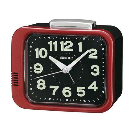 a red clock with a white face and black dial.