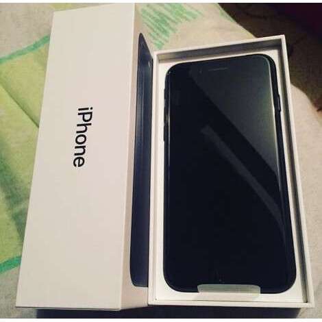 a box with a black iphone inside of it.