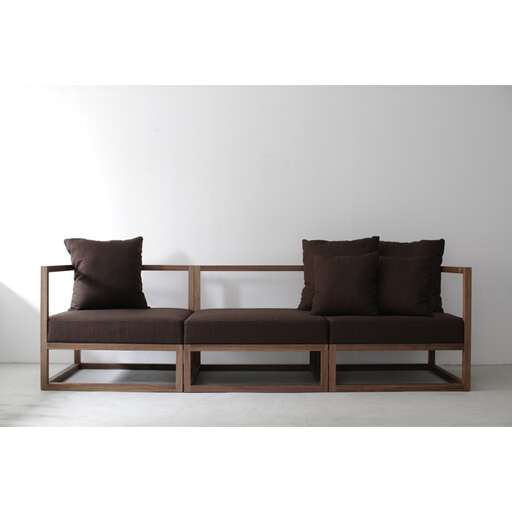 a wooden bench with a wooden frame and two pillows.