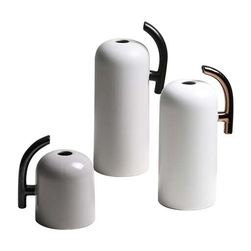 a set of three - sided ceramic white ceramic candle holders.