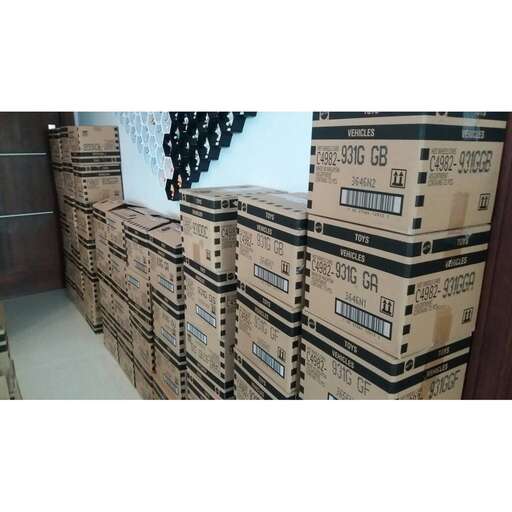 a stack of boxes sitting on top of a floor.