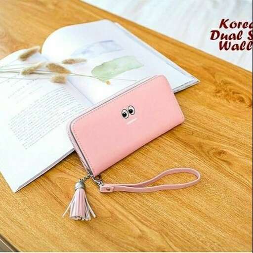 a phone case with a pink case on a table.