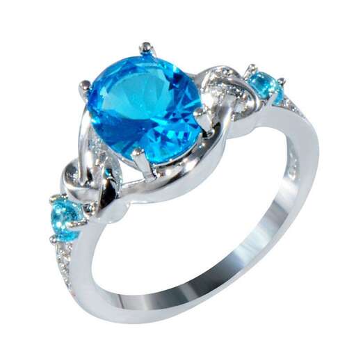 a sapphire and diamond ring, by person