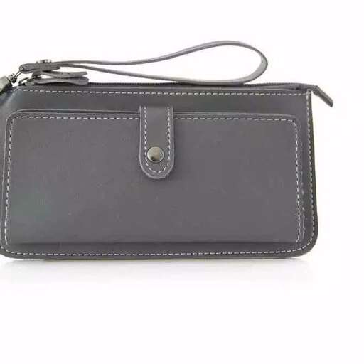 a small leather wallet with a strap on it.