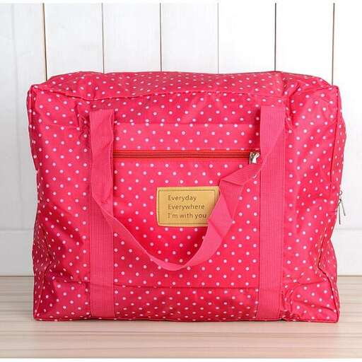 a small bag with a little girl in pink