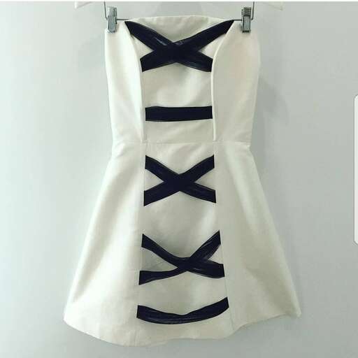 white dress with black straps.
