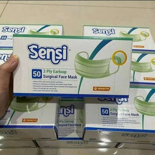 a person holding up a box of tissues.