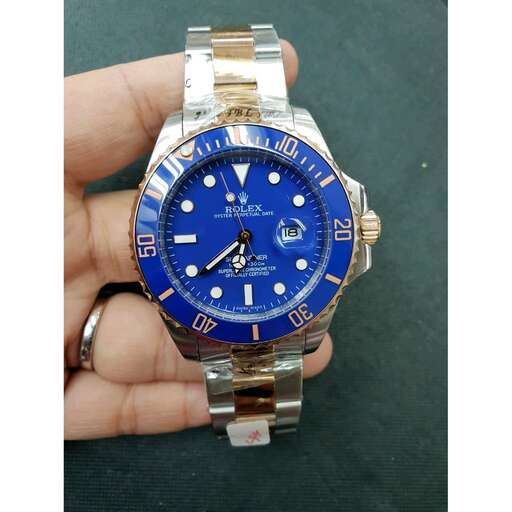 a watch with a blue face and gold dial.