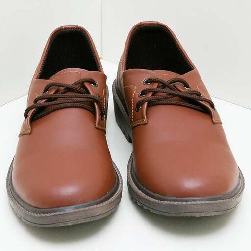 a pair of shoes with laces and a leather sole.