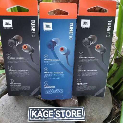 a pair of headphones are displayed on a rock.