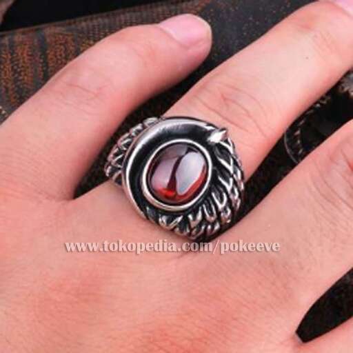a ring with a red stone