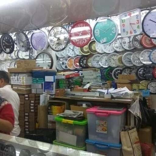 a man standing in front of a display of plates.