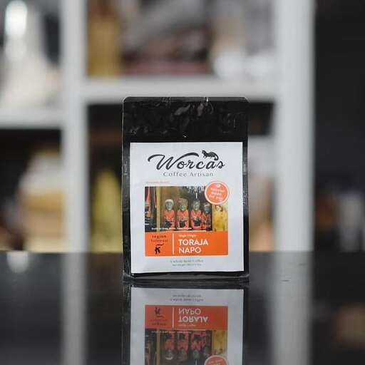 a box of tea on a glass table.