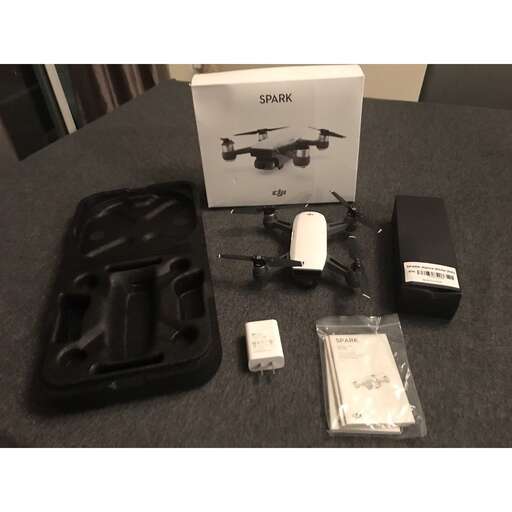 a black bag and some remotes on a table