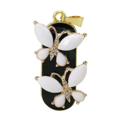 a beautiful pendant with white crystals and a gold plated pendant.