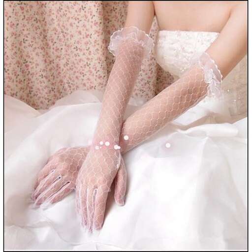 a bride's hands in a wedding dress
