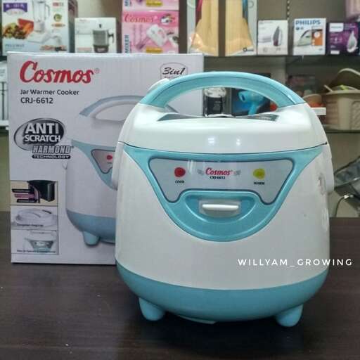 a blue and white appliance sitting on a table.