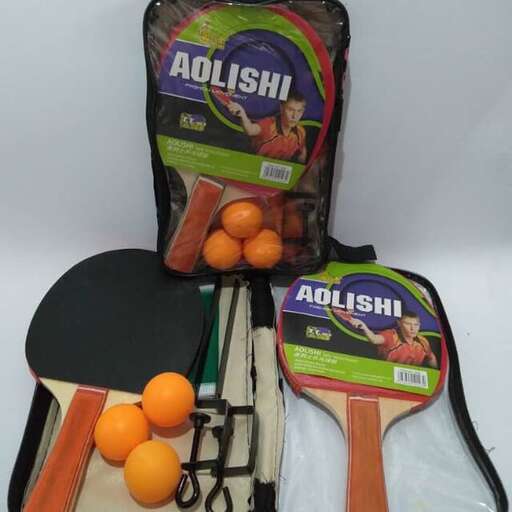 a bag of oranges, a knife, and a bag of fruit.