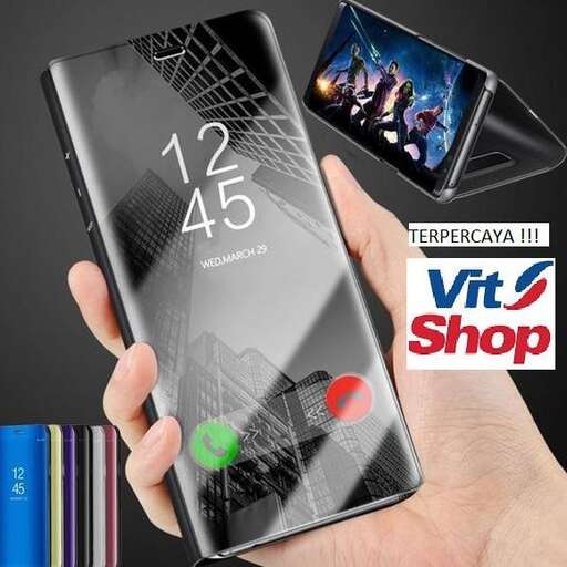 a person holding a smartphone in their hand.