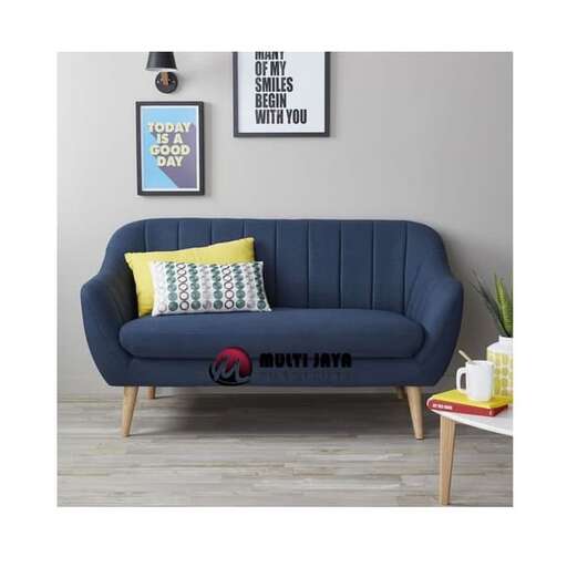 a blue couch with a yellow pillow on it.