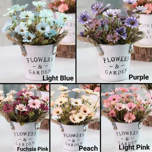 a group of different types of flowers in a white vase.