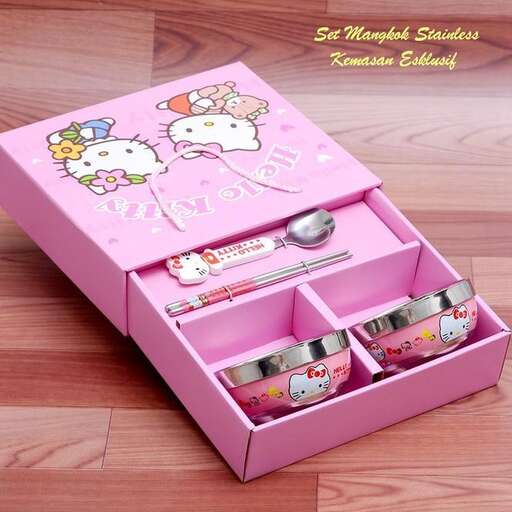a box of hello kitty toothpaste with a hello kitty design on the side.