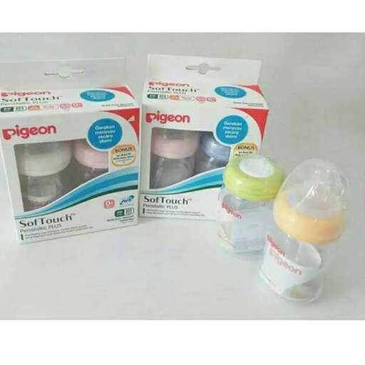 a couple of bags that are next to a baby bottle.