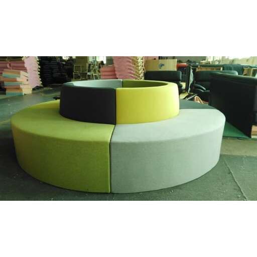 the round coffee table is a modern design with a curved top and a curved base.