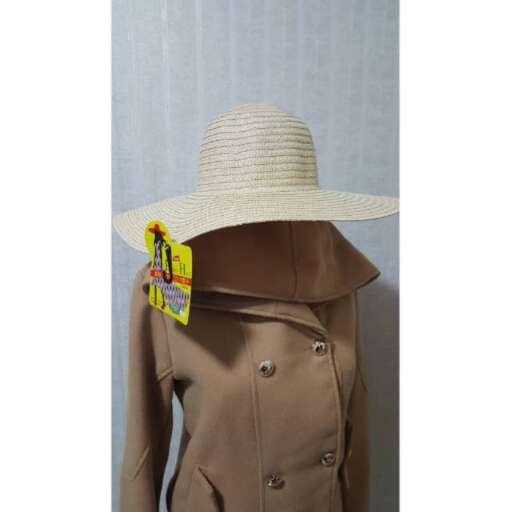 a tan straw hat with a wide brim and a wide brim.