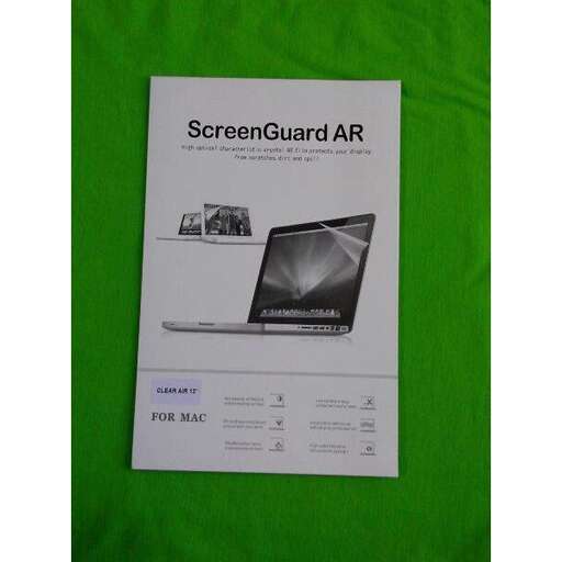 a green blanket with a picture of a laptop.