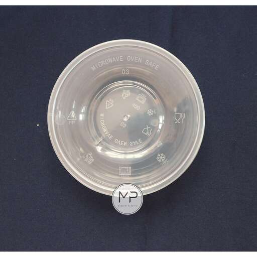 a glass cup with a lid and a small label.