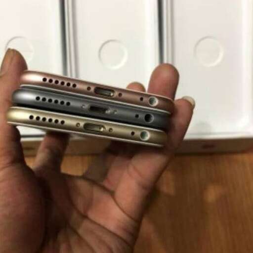 a person holding a cell phone in their hand.