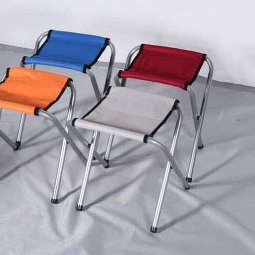 three chairs with different colors and a white background.