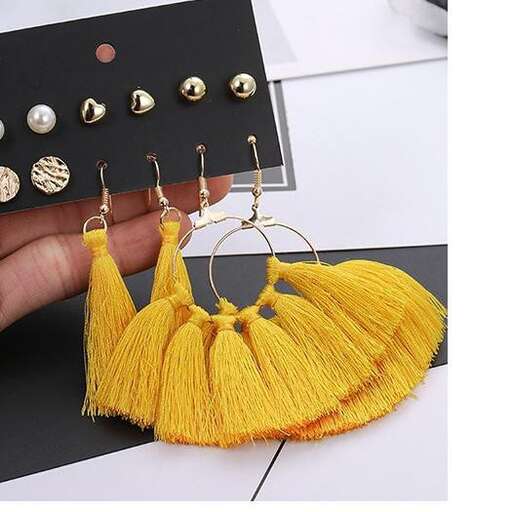 a yellow bag with buttons in the middle.