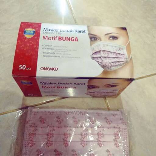 a box of facial tissue with a woman's face on it.