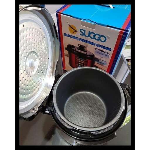 a close up of a coffee pot and a light