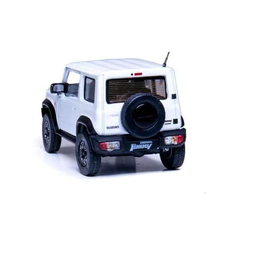 a small white jeep with a black bumper.