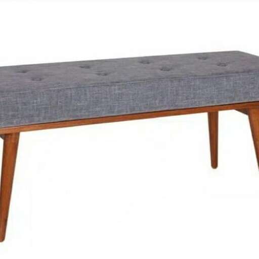 a modern coffee table with a woven seat.