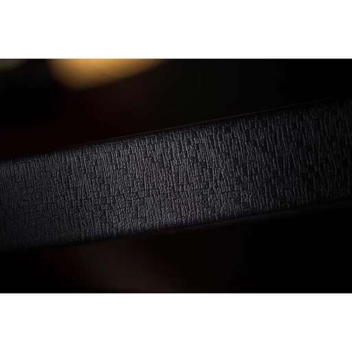 the dark wood grain of the frame