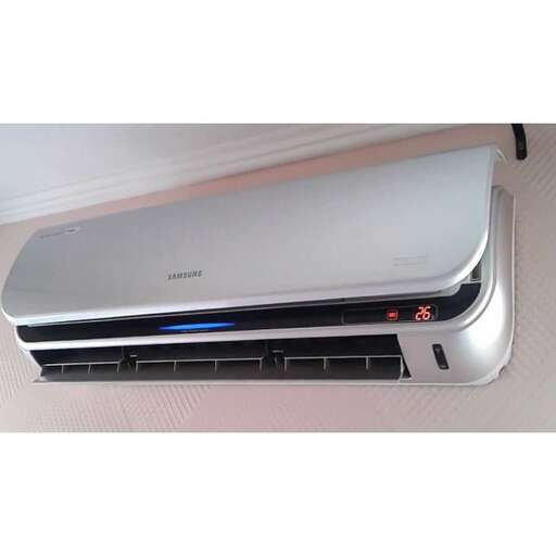 a large air conditioner that is on the floor.