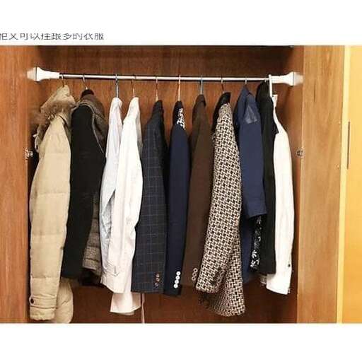 a closet with clothes hanging on the wall.