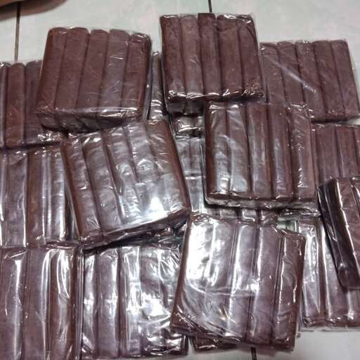 a pile of chocolates that are wrapped in plastic.