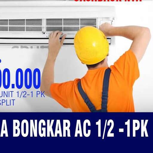 a man in a yellow hard hat is holding a radiator.