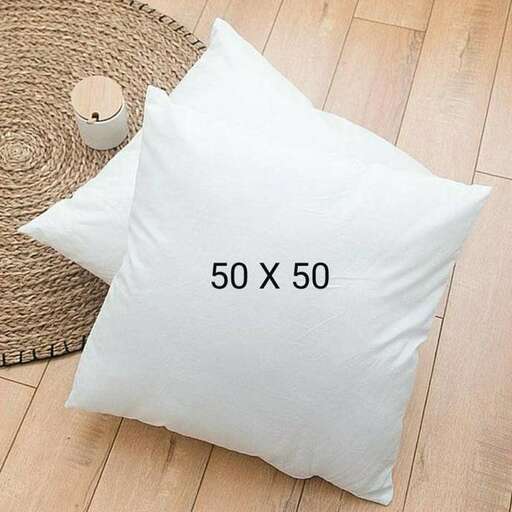 a pillow with a coffee cup on top of it.