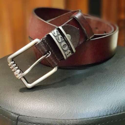 a leather belt with a buckle and a buckle.
