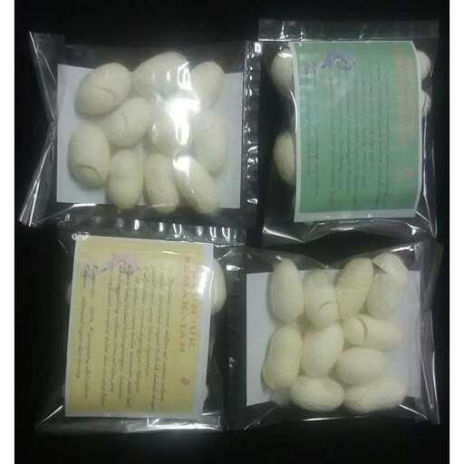 a group of plastic containers filled with eggs.