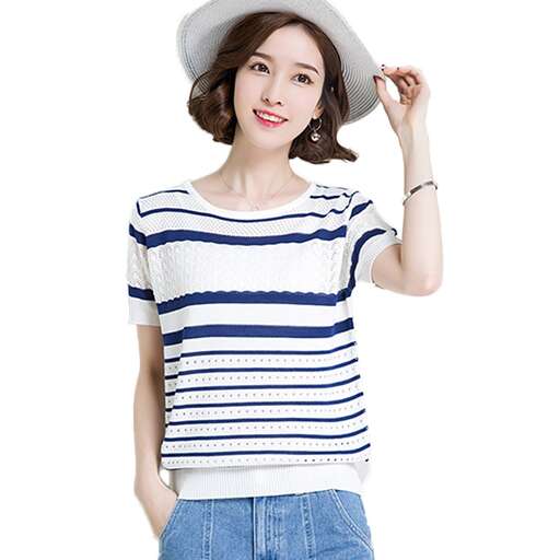 a woman in a white hat and blue jeans.