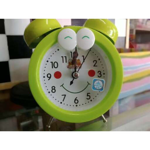 a clock with eyes and eyes.