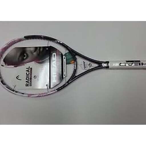 a tennis racket with a pair of scissors in it.