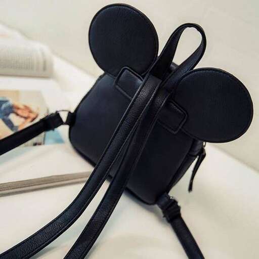 a purse with a strap and a purse on it.